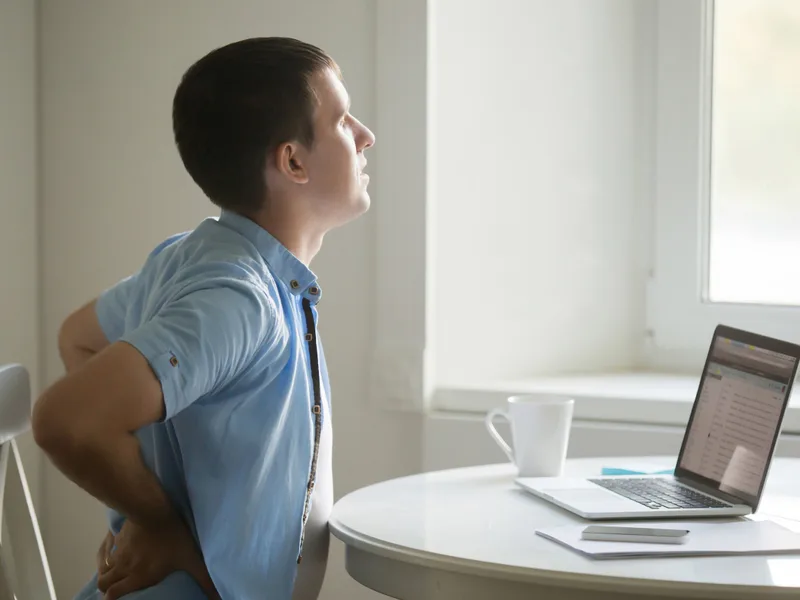 Restore24 Chiropractic treating back pain in Overland Park